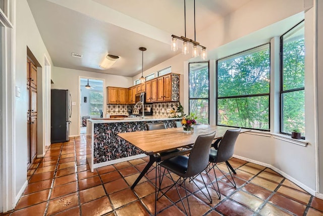 8660 Ephraim Rd, Austin, TX 78717 - dining room with baseboards and tile patterned flooring