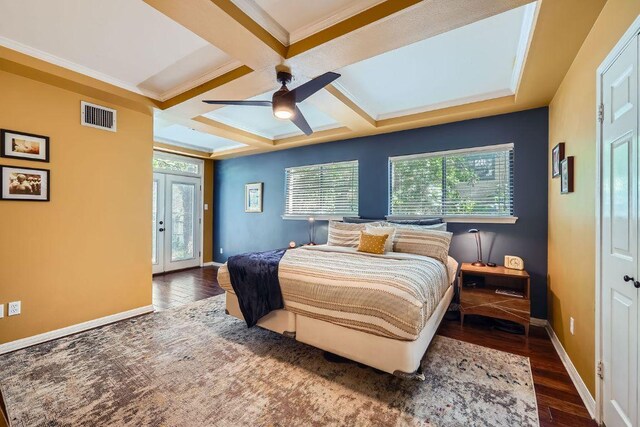 8660 Ephraim Rd, Austin, TX 78717 - bedroom with coffered ceiling, multiple windows, wood finished floors, baseboards, and beamed ceiling