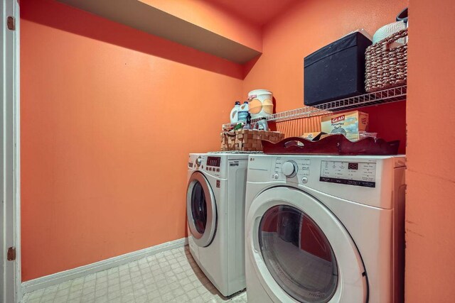 8660 Ephraim Rd, Austin, TX 78717 - laundry room featuring light floors, separate washer and dryer, and baseboards