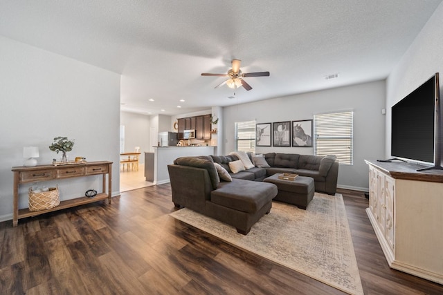 400 Westminster Dr, Kyle, TX 78640 - living room featuring ceiling fan, dark wood finished floors, baseboards, and recessed lighting