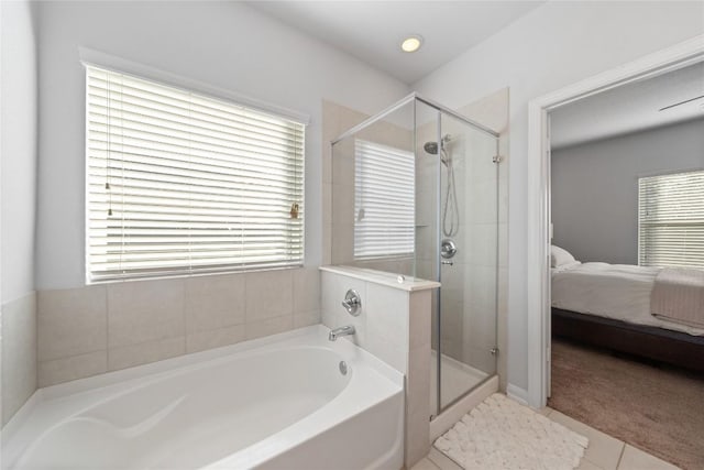 400 Westminster Dr, Kyle, TX 78640 - ensuite bathroom with a bath, a shower stall, and tile patterned floors