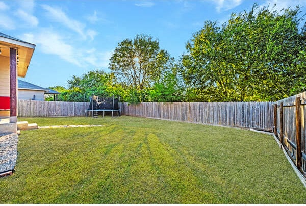 400 Westminster Dr, Kyle, TX 78640 - view of yard with a trampoline