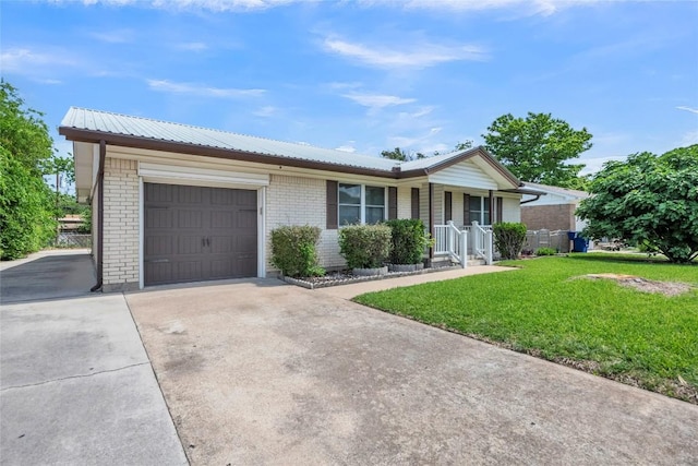 1009 Robertson Ave, Copperas Cove, TX 76522 - ranch-style house with a garage, a front yard, concrete driveway, and metal roof