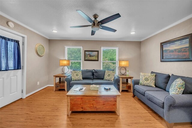 1009 Robertson Ave, Copperas Cove, TX 76522 - living room with crown molding, light wood-style floors, ceiling fan, baseboards, and recessed lighting