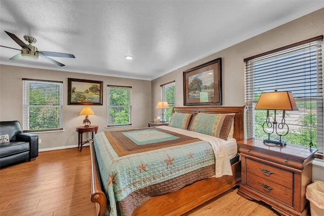 1009 Robertson Ave, Copperas Cove, TX 76522 - bedroom featuring ornamental molding, light wood-type flooring, baseboards, recessed lighting, and a ceiling fan