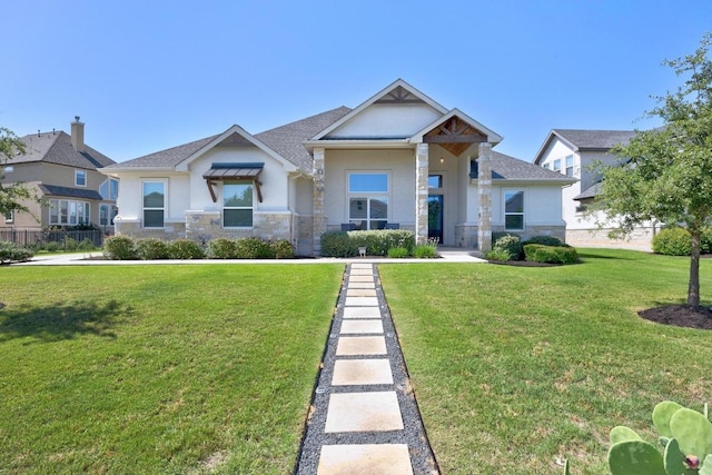 2208 Quarry Loop, Leander, TX 78641 - craftsman inspired home featuring stucco siding, a front yard, and stone siding
