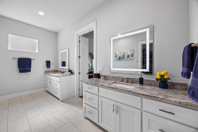 2208 Quarry Loop, Leander, TX 78641 - full bath featuring two vanities and baseboards