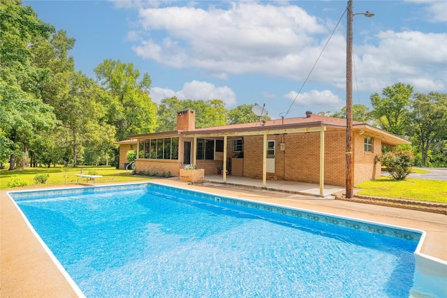 2208 US Highway 96 S, Center, TX 75935 - outdoor pool with a patio area, a lawn, and a diving board