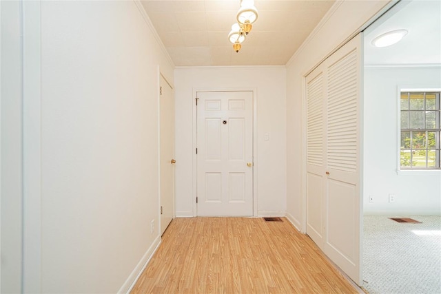 2208 US Highway 96 S, Center, TX 75935 - hallway with crown molding, light wood finished floors, and baseboards