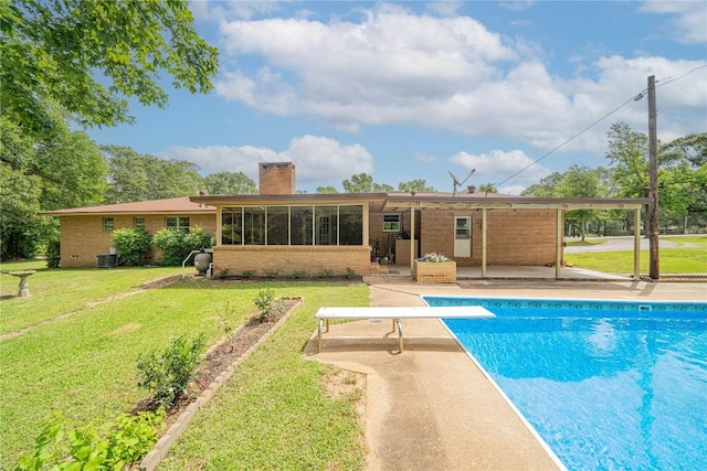 2208 US Highway 96 S, Center, TX 75935 - outdoor pool featuring a diving board, a patio area, a lawn, and cooling unit