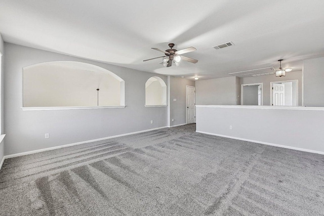 164 Ashwood S, Kyle, TX 78640 - carpeted spare room with ceiling fan, baseboards, and attic access