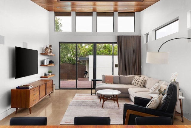15206 General Williamson Dr, Austin, TX 78734 - living room featuring a high ceiling, wooden ceiling, healthy amount of natural light, and finished concrete flooring