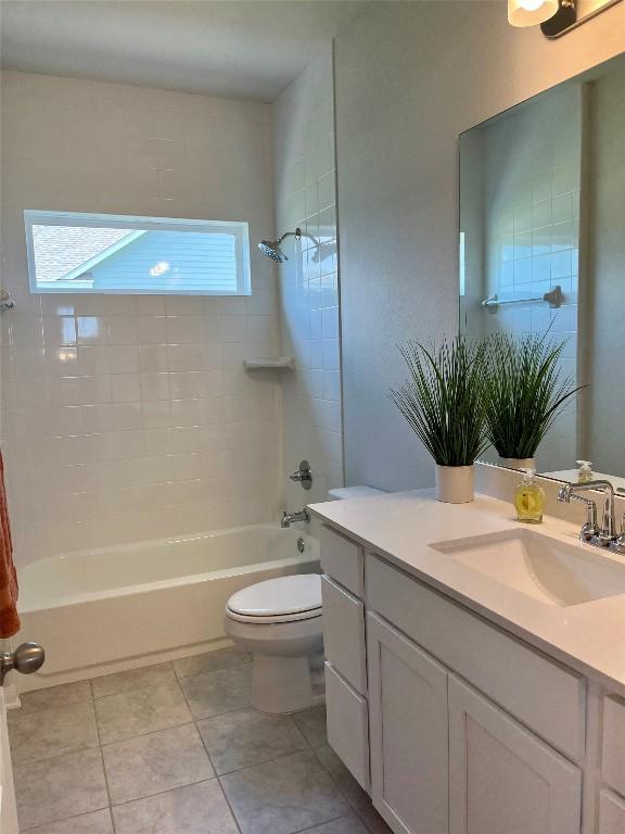 131 Delaware Ln, Kyle, TX 78640 - full bathroom featuring vanity, shower / bath combination, and tile patterned flooring