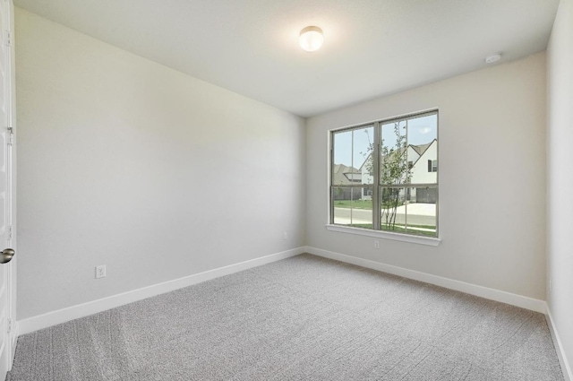 216 Ranchland Pass, Liberty Hill, TX 78642 - spare room with light carpet and a smoke detector