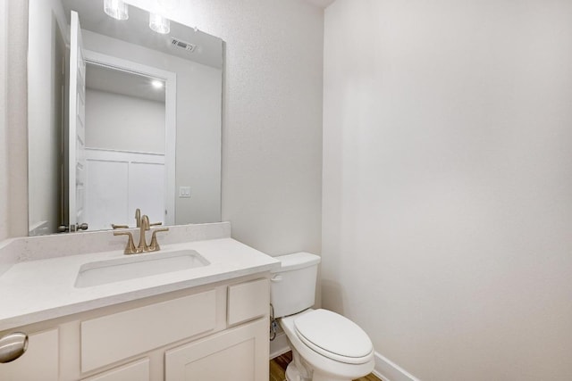 216 Ranchland Pass, Liberty Hill, TX 78642 - half bathroom with vanity and wood finished floors