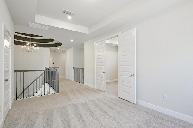 216 Ranchland Pass, Liberty Hill, TX 78642 - unfurnished room with a raised ceiling, a chandelier, carpet, and recessed lighting
