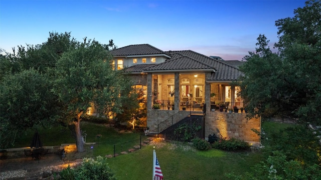 407 Bella Montagna Cir, Austin, TX 78734 - view of front of property featuring stairs, a tiled roof, a porch, and stone siding