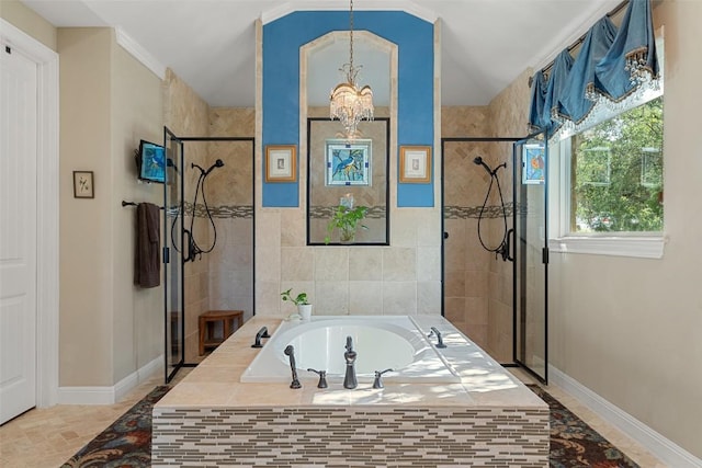 407 Bella Montagna Cir, Austin, TX 78734 - full bathroom with a stall shower, a bath, a chandelier, baseboards, and lofted ceiling
