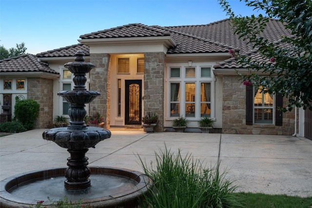 407 Bella Montagna Cir, Austin, TX 78734 - mediterranean / spanish-style house featuring stone siding and a tile roof