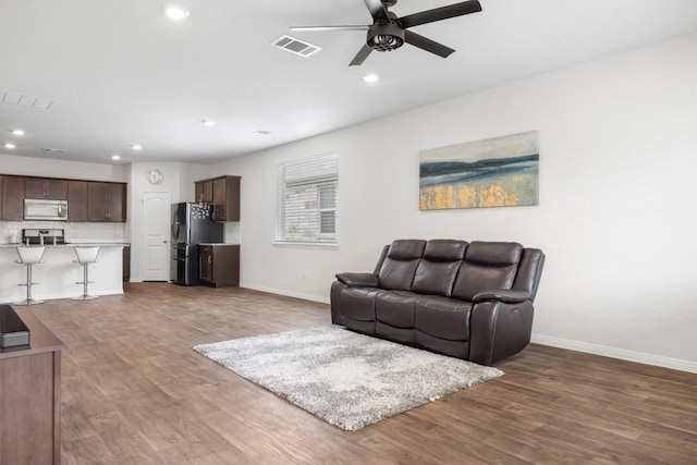 936 Vogel Dr, Georgetown, TX 78626 - living area featuring a ceiling fan, wood finished floors, and recessed lighting