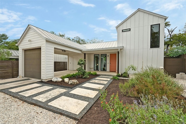 4416 Gillis St Unit B, Austin, TX 78745 - modern farmhouse style home with board and batten siding, a standing seam roof, an attached garage, metal roof, and covered porch