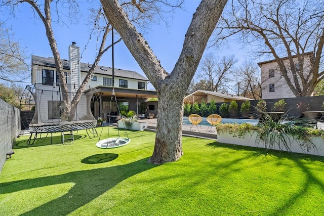 1102 Kinney Ave, Austin, TX 78704 - fenced backyard with a trampoline and a patio