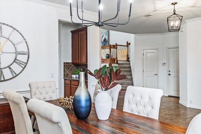 295 Desert Wilow Way, Austin, TX 78737 - tiled dining room with a chandelier, stairs, and ornamental molding