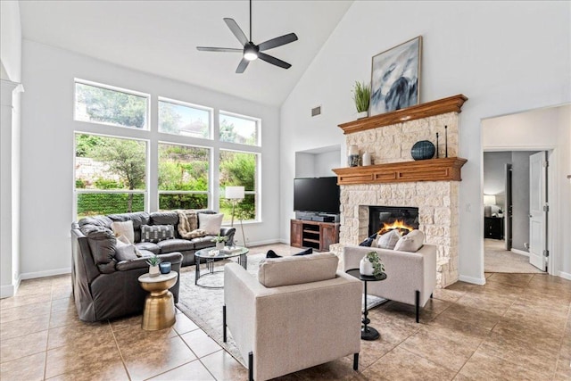 295 Desert Wilow Way, Austin, TX 78737 - living area with high vaulted ceiling, a fireplace, a ceiling fan, plenty of natural light, and light tile patterned flooring