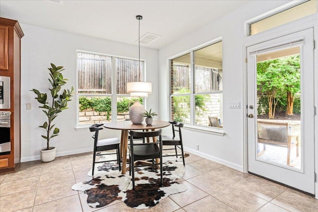 295 Desert Wilow Way, Austin, TX 78737 - dining area featuring light tile patterned flooring and baseboards