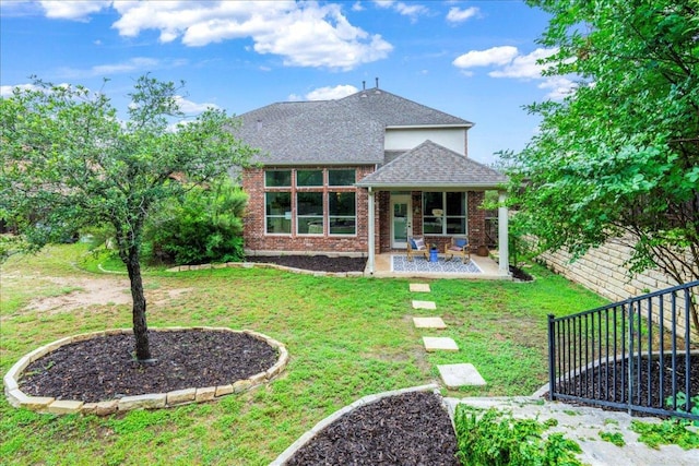 295 Desert Wilow Way, Austin, TX 78737 - rear view of property featuring a shingled roof, a patio area, and brick siding