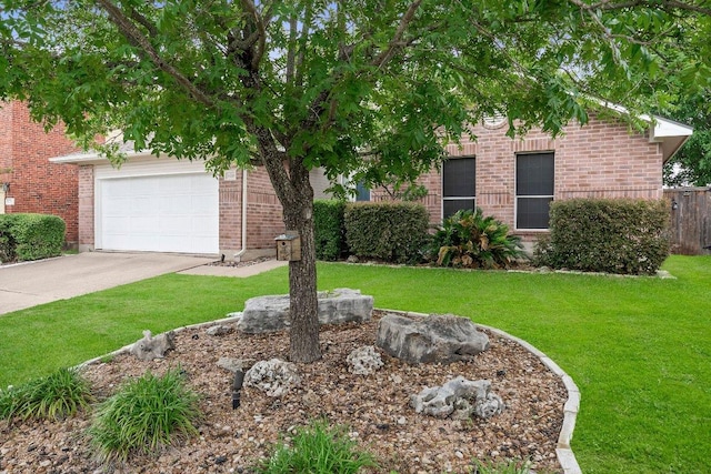 11220 Amaranth Ln, Austin, TX 78754 - obstructed view of property with driveway, brick siding, and a garage