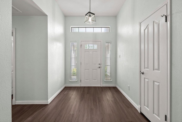 11220 Amaranth Ln, Austin, TX 78754 - entryway with dark wood-type flooring and baseboards