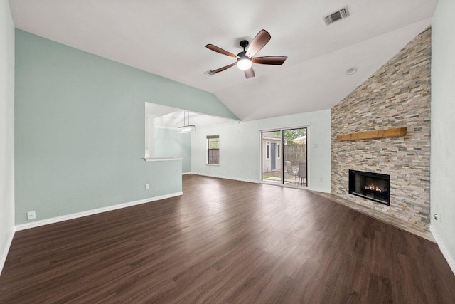 11220 Amaranth Ln, Austin, TX 78754 - unfurnished living room with ceiling fan, vaulted ceiling, dark wood-style flooring, a fireplace, and baseboards