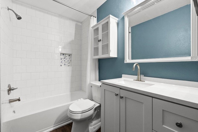 11220 Amaranth Ln, Austin, TX 78754 - bathroom with shower / bathtub combination with curtain, vanity, toilet, wood finished floors, and a textured wall
