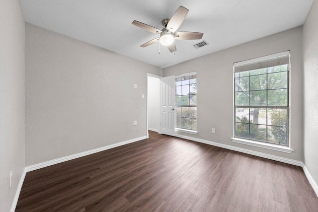11220 Amaranth Ln, Austin, TX 78754 - spare room with dark wood finished floors, baseboards, and a ceiling fan