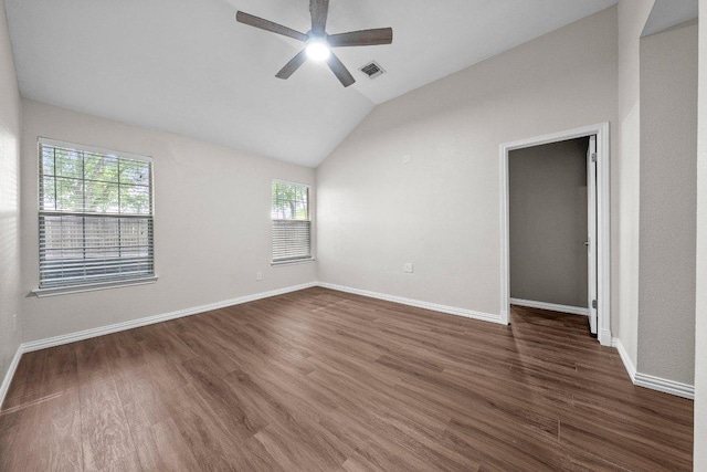 11220 Amaranth Ln, Austin, TX 78754 - empty room with ceiling fan, dark wood-style flooring, vaulted ceiling, and baseboards