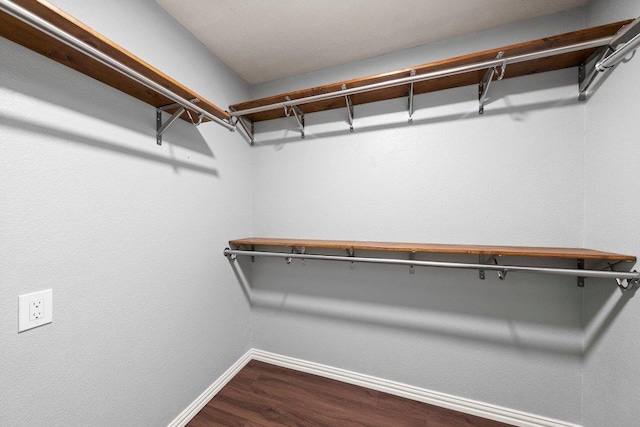 11220 Amaranth Ln, Austin, TX 78754 - spacious closet featuring dark wood-type flooring