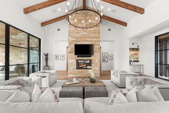 12625 Maidenhair Ln Unit 32, Austin, TX 78738 - living area with beam ceiling, wood finished floors, high vaulted ceiling, a chandelier, and baseboards