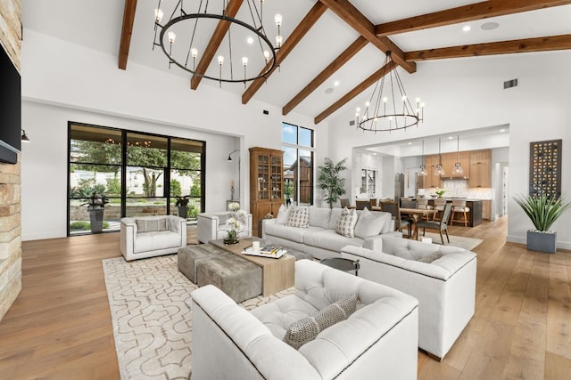 12625 Maidenhair Ln Unit 32, Austin, TX 78738 - living room featuring a chandelier, high vaulted ceiling, beam ceiling, light wood finished floors, and recessed lighting