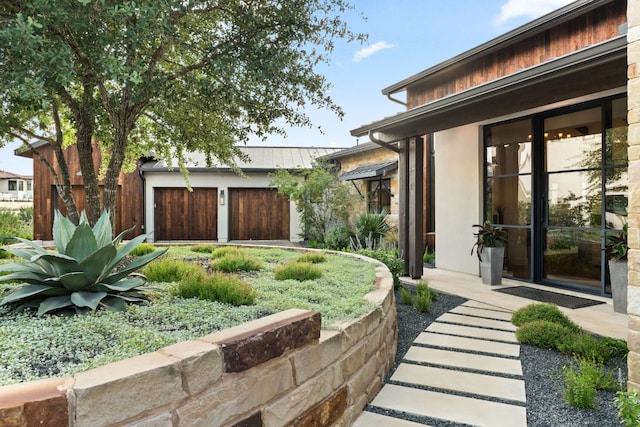 12625 Maidenhair Ln Unit 32, Austin, TX 78738 - view of yard featuring an attached garage and an outbuilding