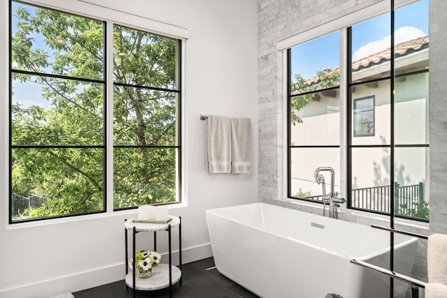 12625 Maidenhair Ln Unit 32, Austin, TX 78738 - bathroom featuring a freestanding bath and baseboards