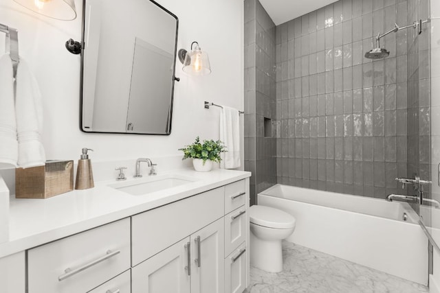 12625 Maidenhair Ln Unit 32, Austin, TX 78738 - bathroom featuring marble look tile flooring, vanity, toilet, and washtub / shower combination