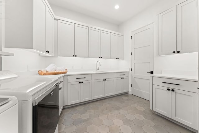 12625 Maidenhair Ln Unit 32, Austin, TX 78738 - laundry area with washer and dryer, cabinet space, recessed lighting, and light tile patterned floors
