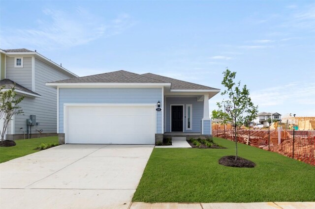 246 Barley Ln, Elgin, TX 78621 - view of front of property featuring driveway, an attached garage, and a shingled roof