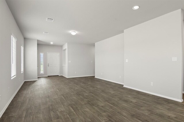 246 Barley Ln, Elgin, TX 78621 - empty room featuring dark wood-style flooring and recessed lighting