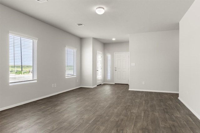 246 Barley Ln, Elgin, TX 78621 - unfurnished room with dark wood finished floors and baseboards