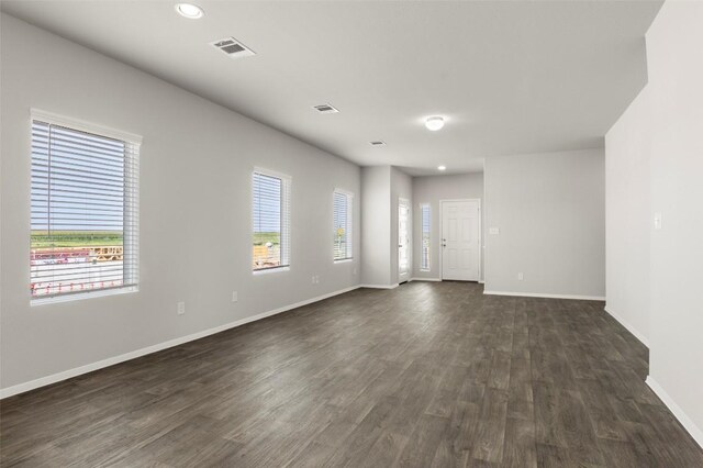 246 Barley Ln, Elgin, TX 78621 - unfurnished room featuring dark wood finished floors and recessed lighting