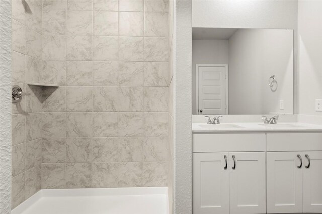 246 Barley Ln, Elgin, TX 78621 - bathroom with double vanity and a tile shower