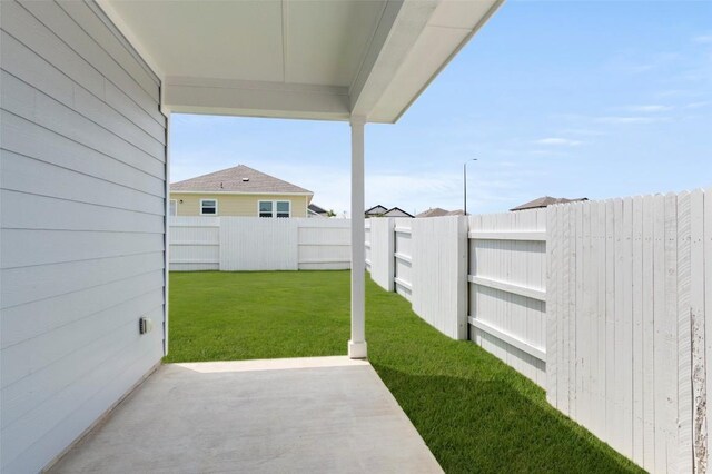 246 Barley Ln, Elgin, TX 78621 - fenced backyard featuring a patio