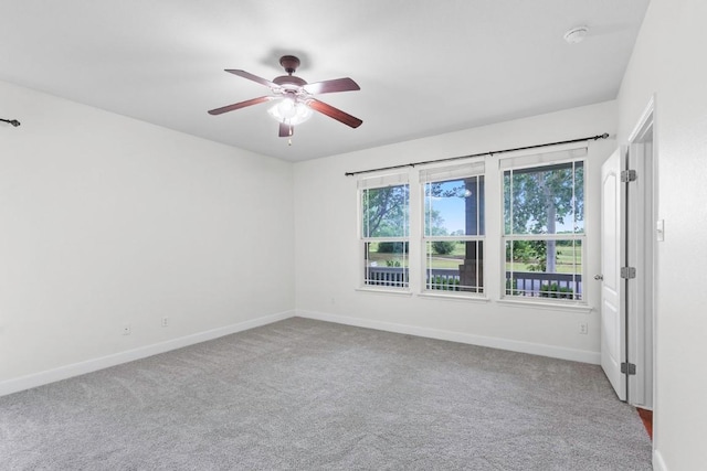 221 Mcgarity St, Kyle, TX 78640 - empty room with baseboards, carpet, and ceiling fan